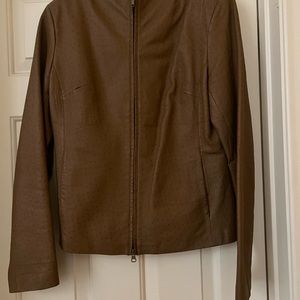 100% leather jacket, used but in excellent condition, brown color